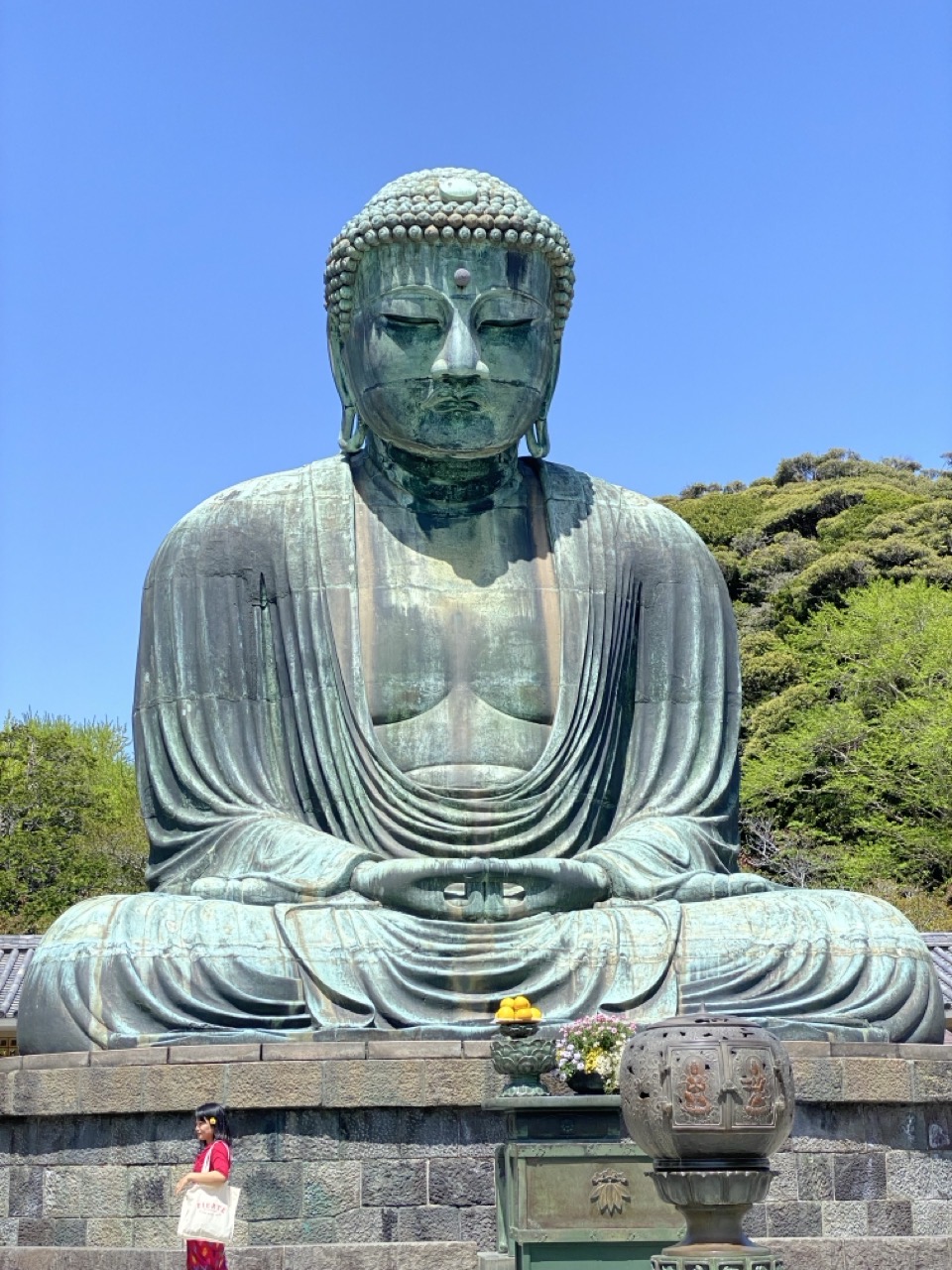 The great Buddha, with trees and a blue sky in the background