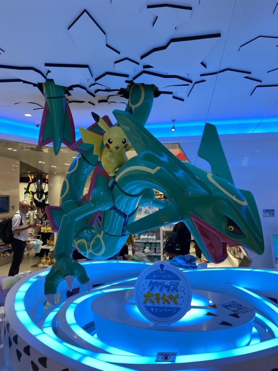 A big statue of Pikachu riding a Rayquaza