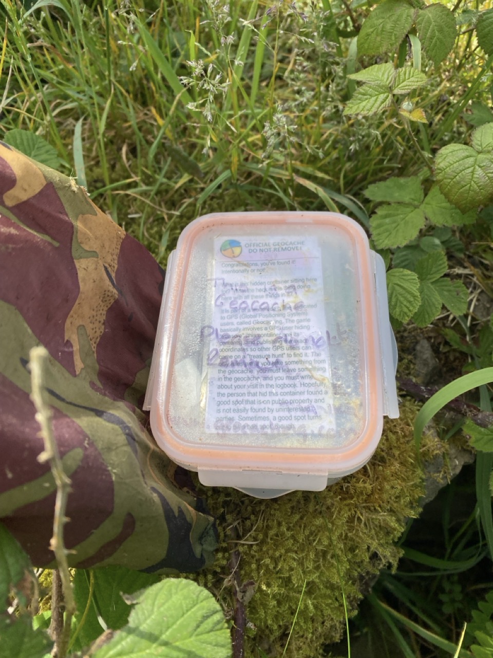 A geocache box. There’s a label on it explaining what it is.