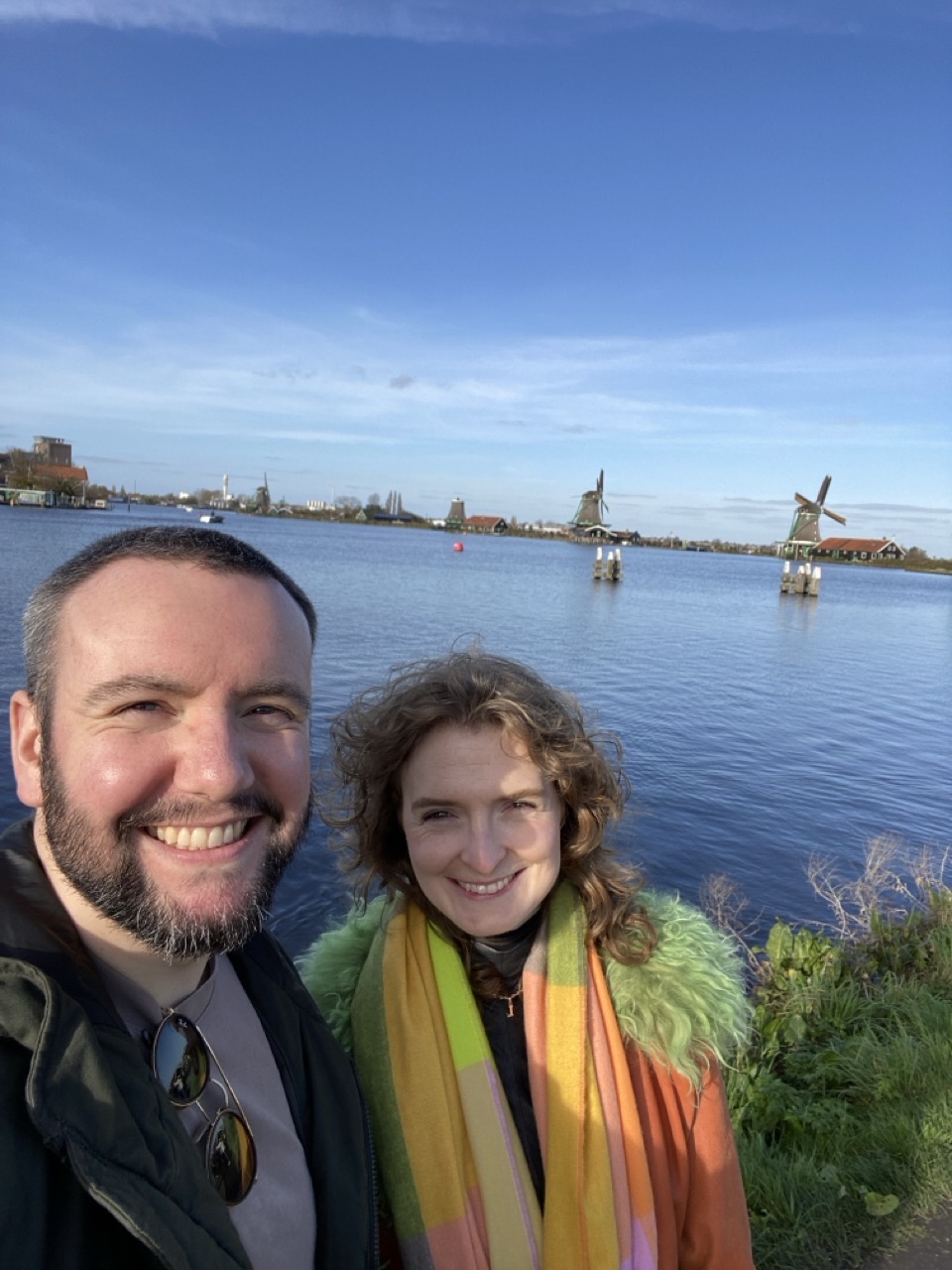 Me and Lucy with the windmills squinting in the sun