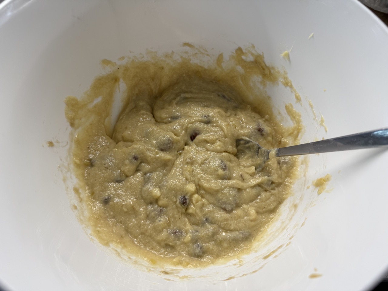 Banana bread mixture in a bowl. It looks kinda gross tbh