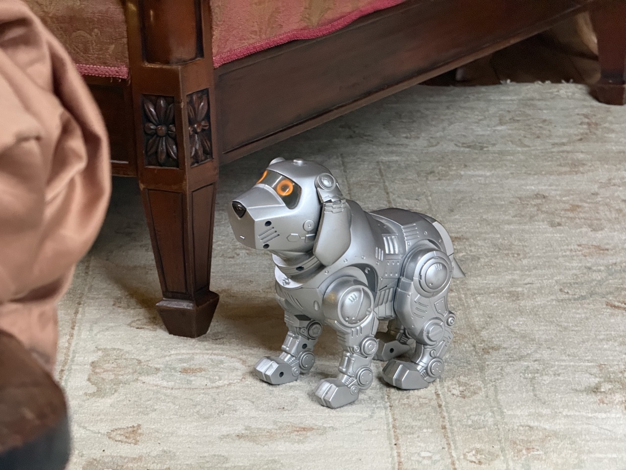It’s a Telstra, a grey robot dog from the early 2000s I think It’s a Telstra, a grey robot dog from the early 2000s I think