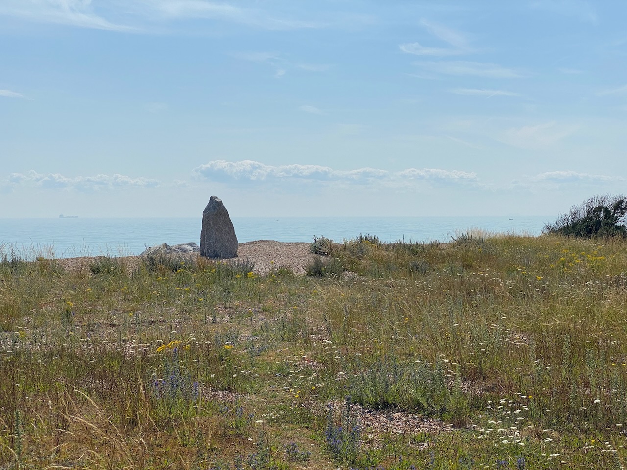 A standing stone by the sea.